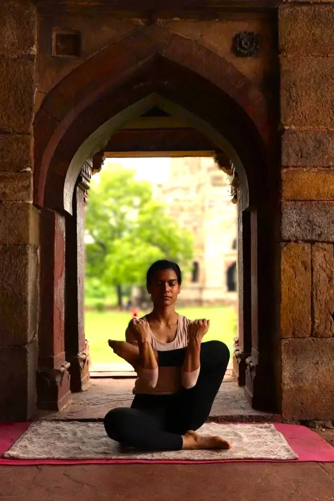 Meditation in an ancient Indian archway